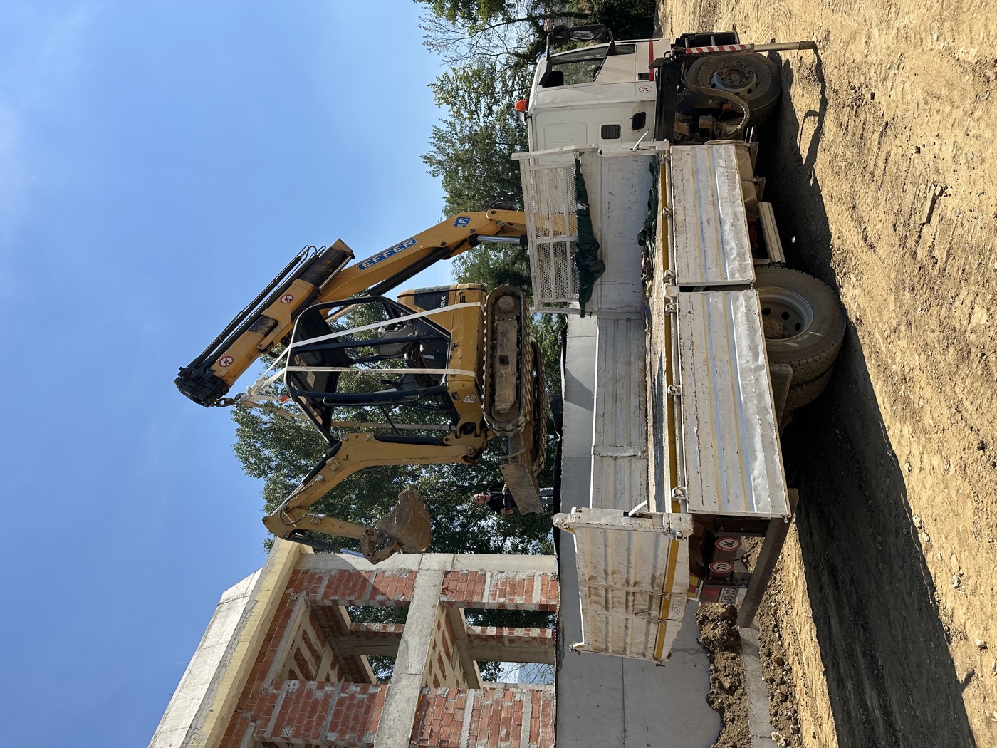 Joy Construction truck-mounted crane lifting on site